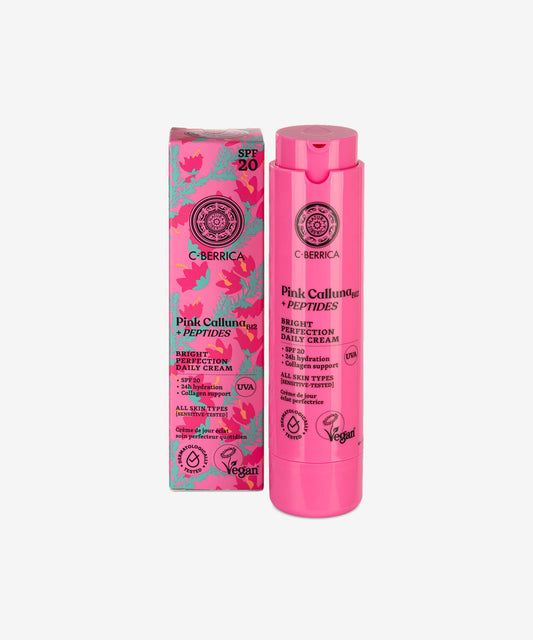 Pink skincare product with floral packaging on a white background