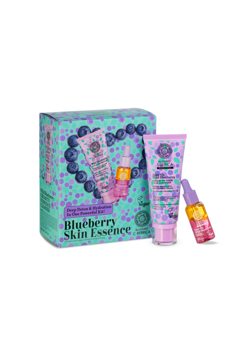 Blueberry-themed skincare product set including a box, face cleanser, and face serum